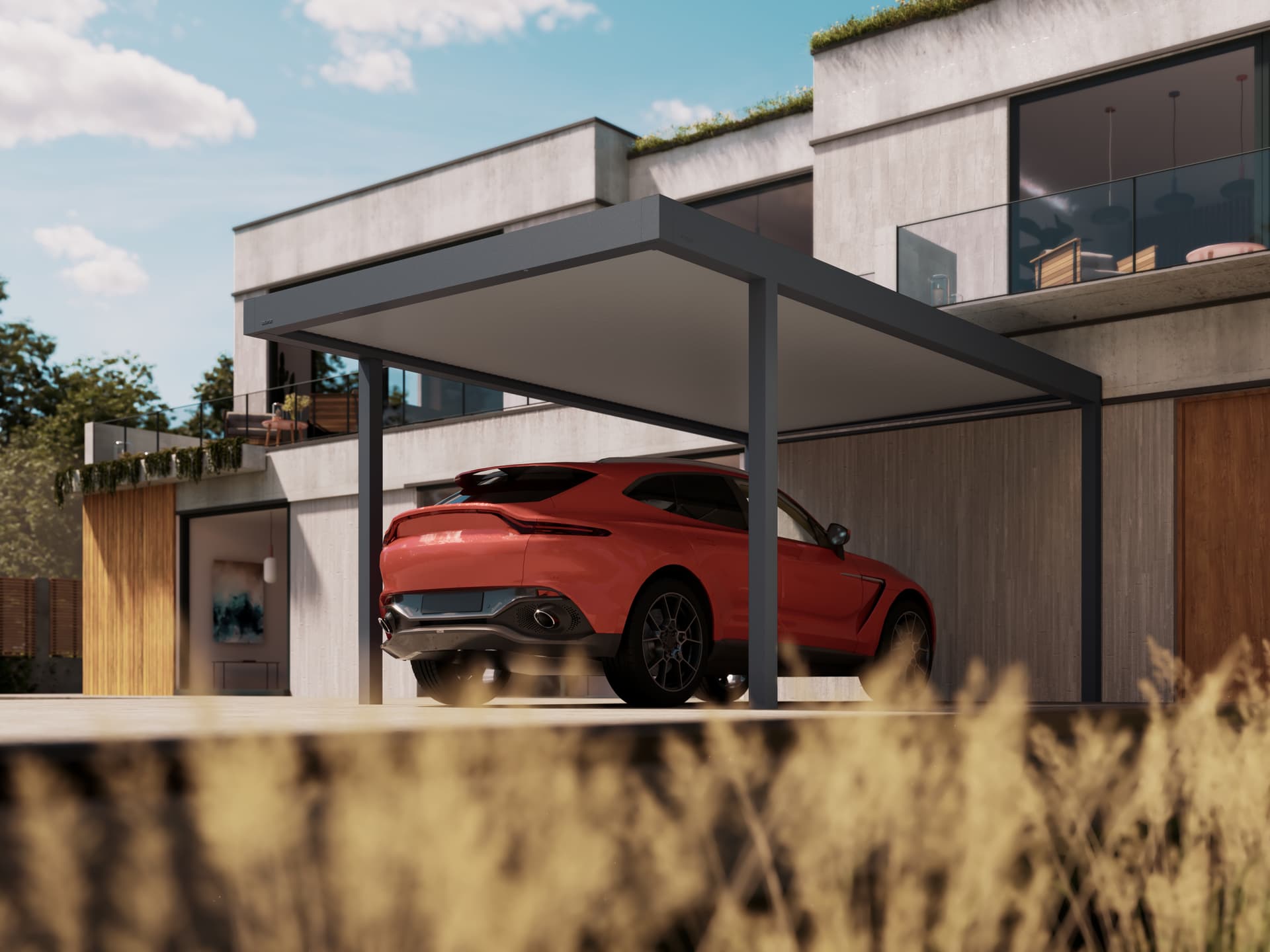 Maison moderne minimaliste avec carport en aluminium à toit plat, offrant un stationnement couvert pour une voiture de sport rouge.